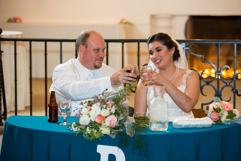 bride and groom toast wedding photography